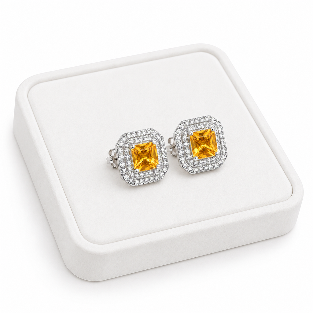 Natural 4mm citrine double halo earrings displayed on white jewelry tray