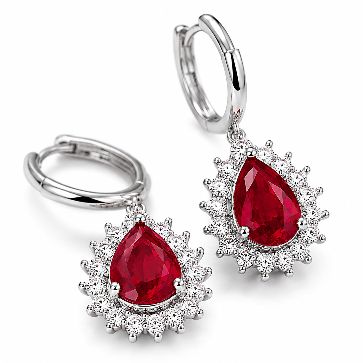 Macro view of vivid red 6x8mm pear-cut natural ruby gemstones and sparkling halo accents