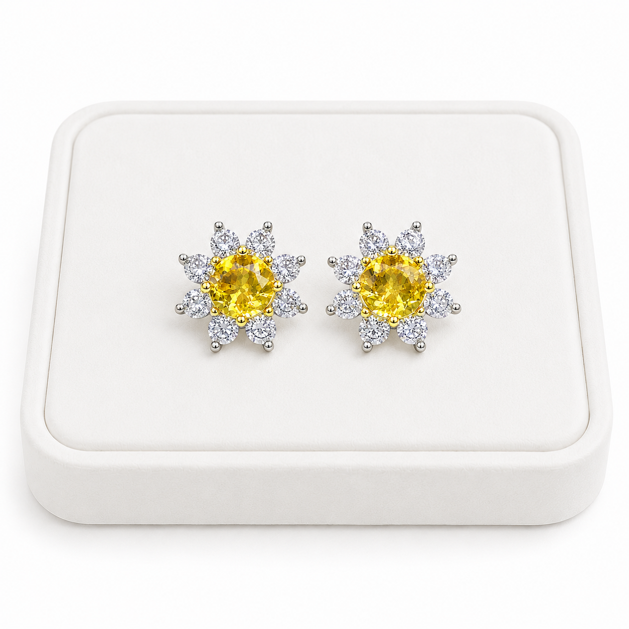 Natural citrine floral halo earrings displayed on a white luxury jewelry tray
