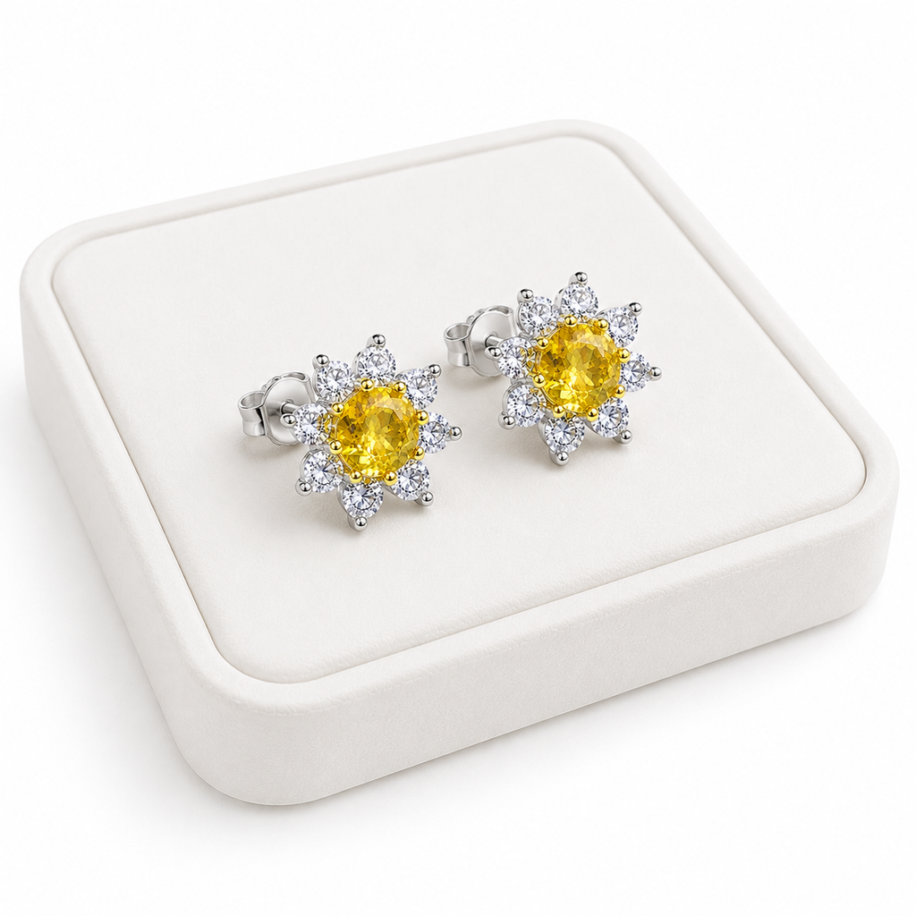 Natural citrine floral halo earrings displayed on a white luxury jewelry tray