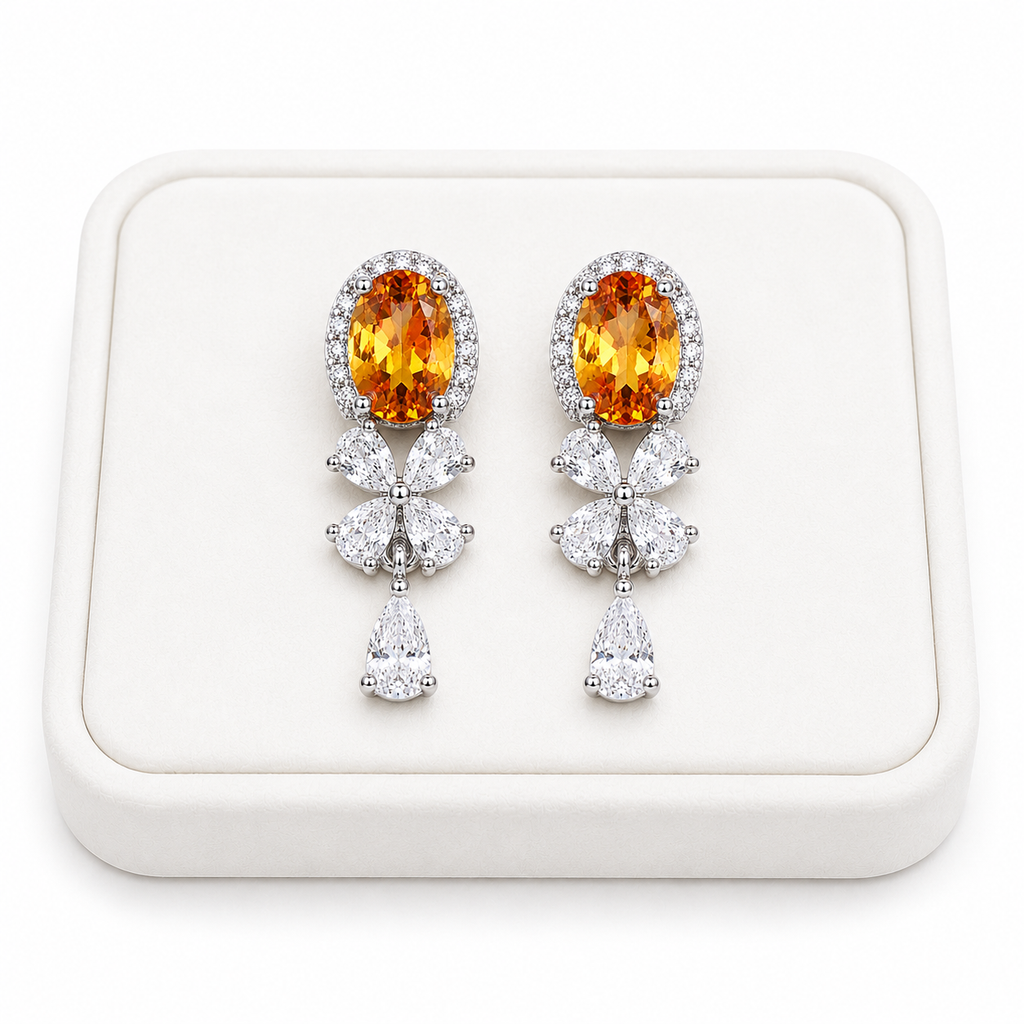Natural citrine drop earrings displayed on a luxury white jewelry tray