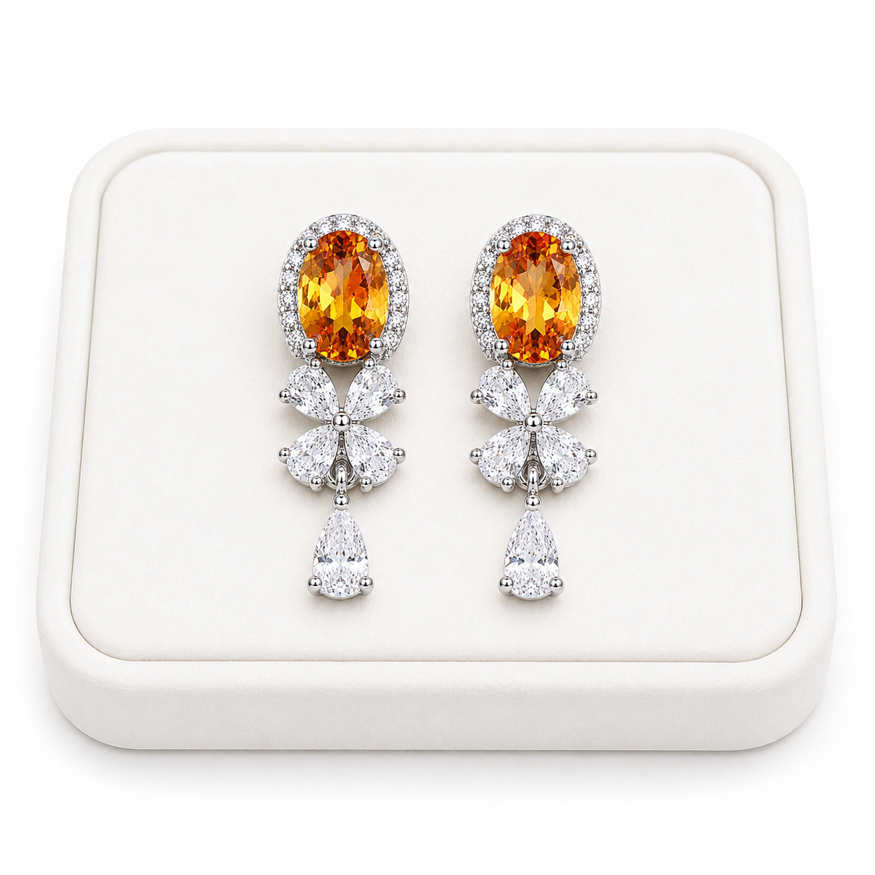 Natural citrine drop earrings displayed on a luxury white jewelry tray