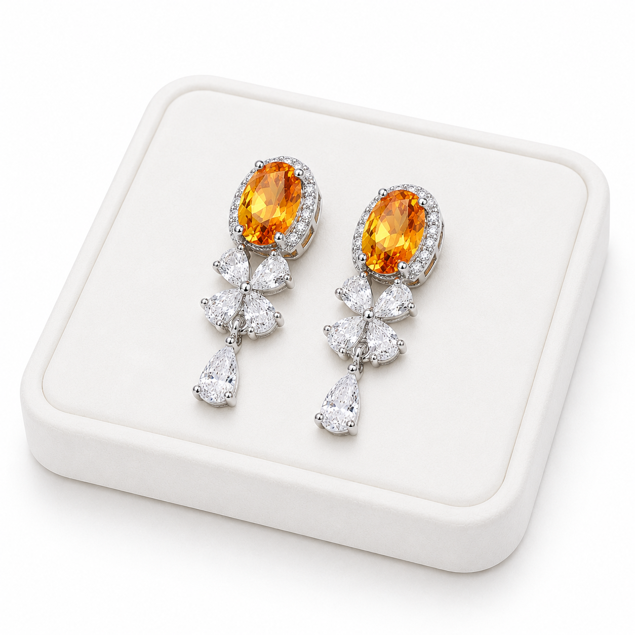 Natural citrine drop earrings displayed on a luxury white jewelry tray