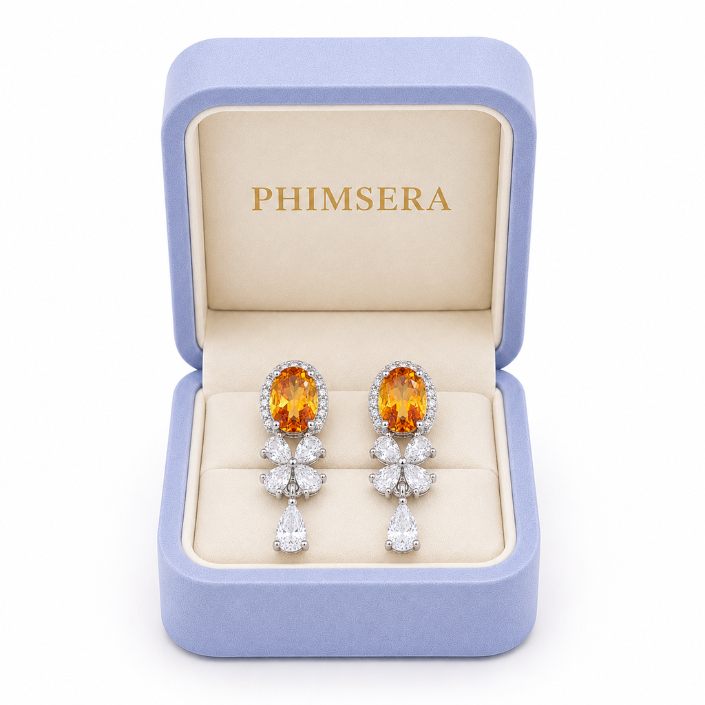 Natural citrine 5x7mm earrings presented inside a Phimsera jewelry gift box