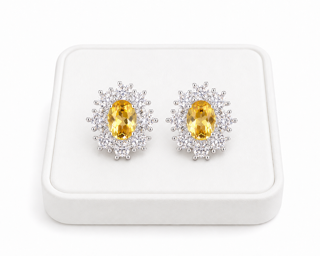Phimsera natural citrine stud earrings displayed at an angle on a white jewelry tray