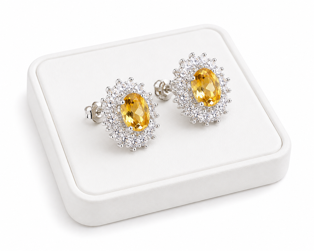 Phimsera natural citrine stud earrings displayed at an angle on a white jewelry tray