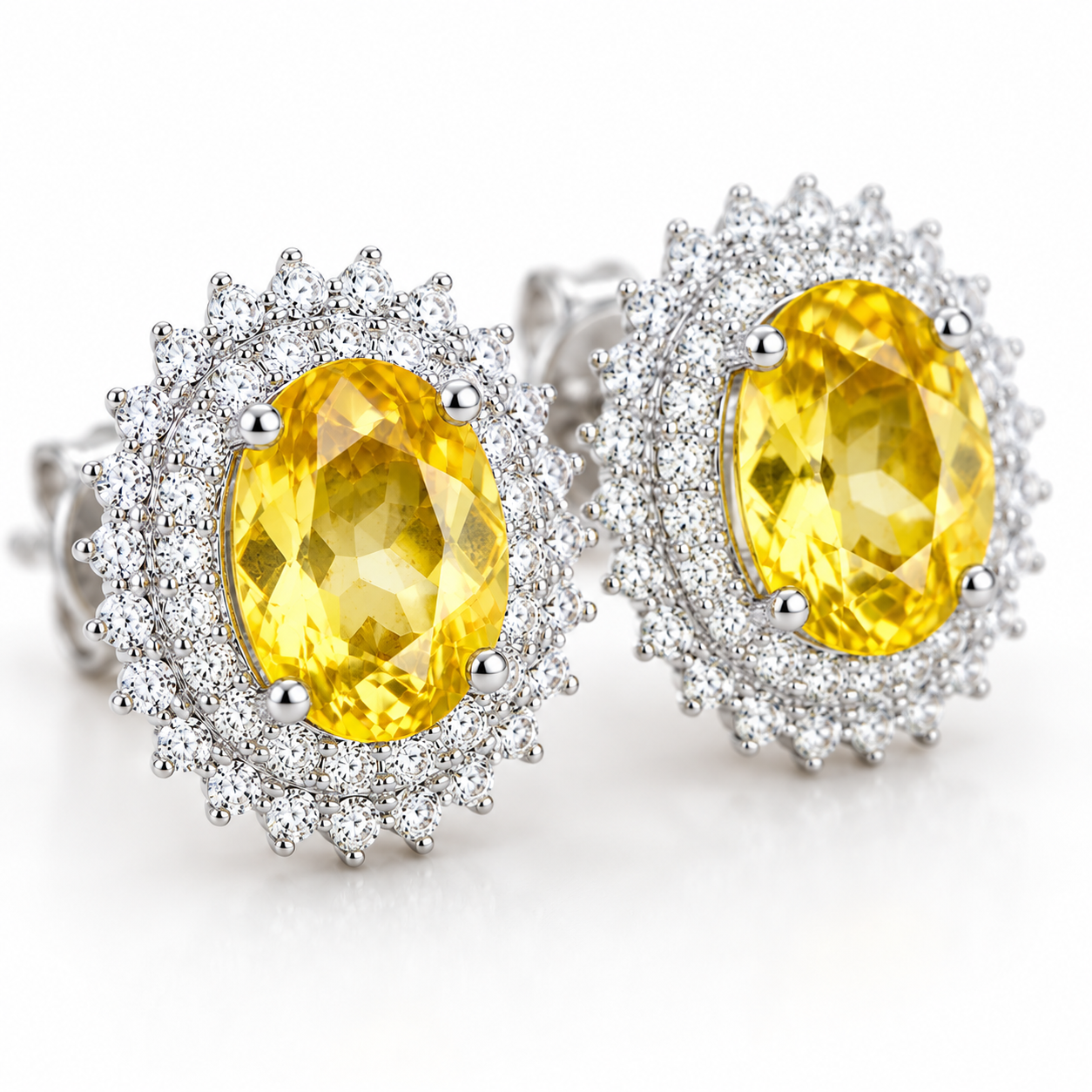 Macro close-up of bright golden yellow 6x8mm citrine earrings with sparkling cubic zirconia accents