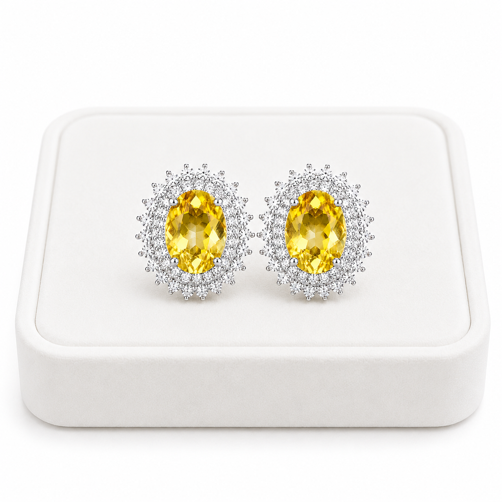 Natural citrine halo stud earrings displayed on a luxury white jewelry tray