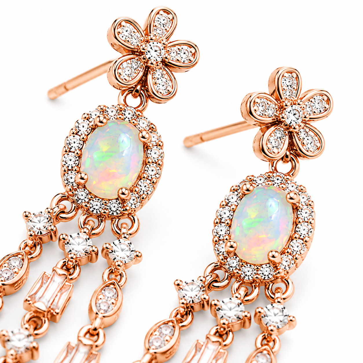 Macro close-up of natural 4x6mm fire opal earrings showing green yellow orange and pink play-of-color