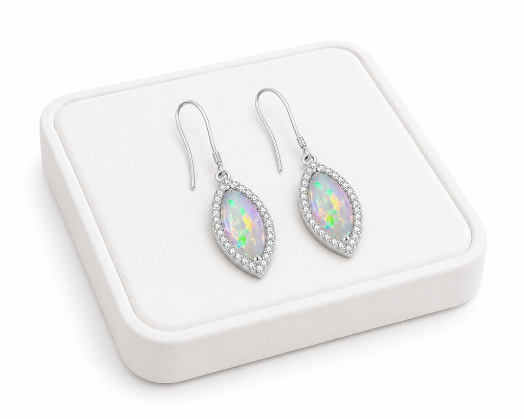 5x10mm marquise opal earrings on white jewelry display tray with sterling silver setting