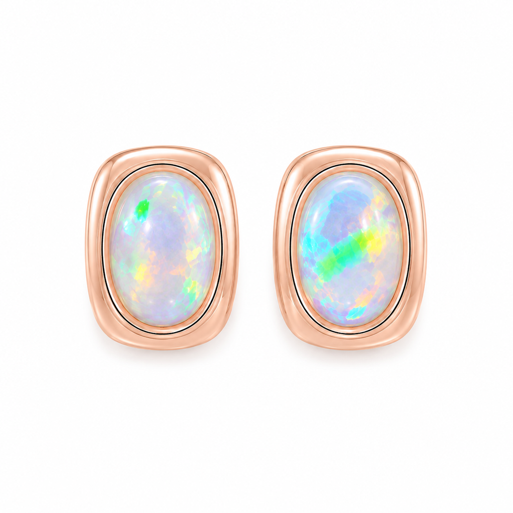 Top view of oval 5x7mm natural fire opal earrings with colorful play-of-color