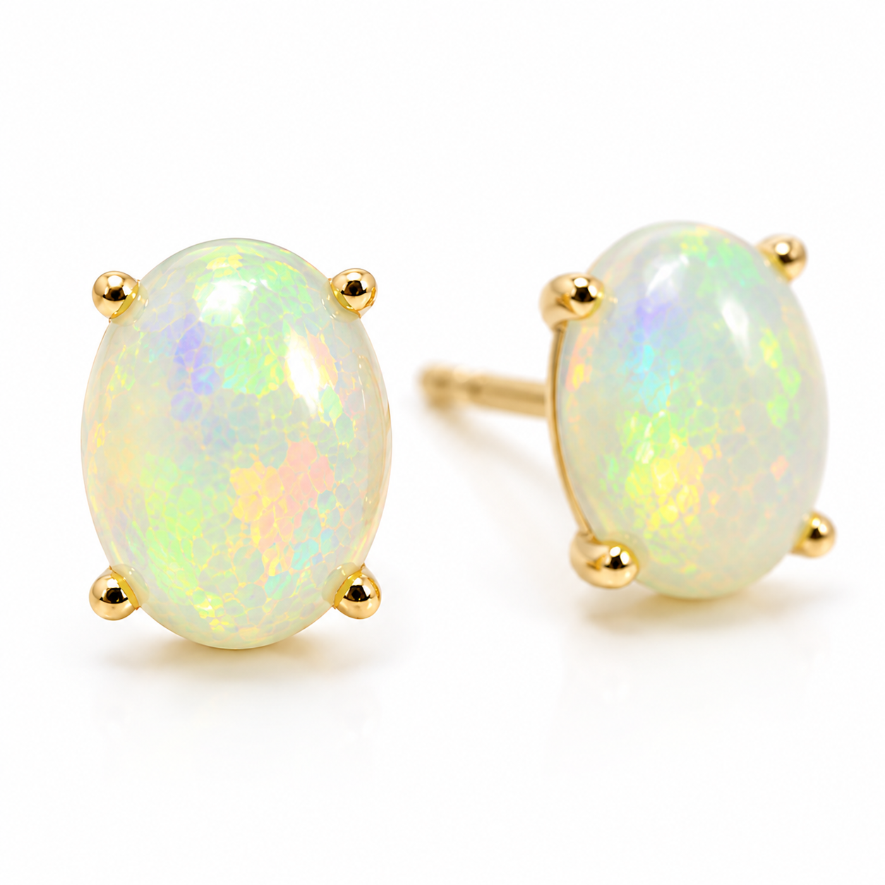 Macro close-up of natural 6x8mm fire opal earrings showing green blue yellow and orange play-of-color
