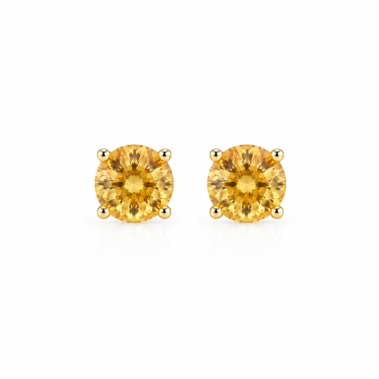 Natural 5mm round citrine stud earrings featuring genuine golden citrine gemstones in classic four-prong 925 silver settings.