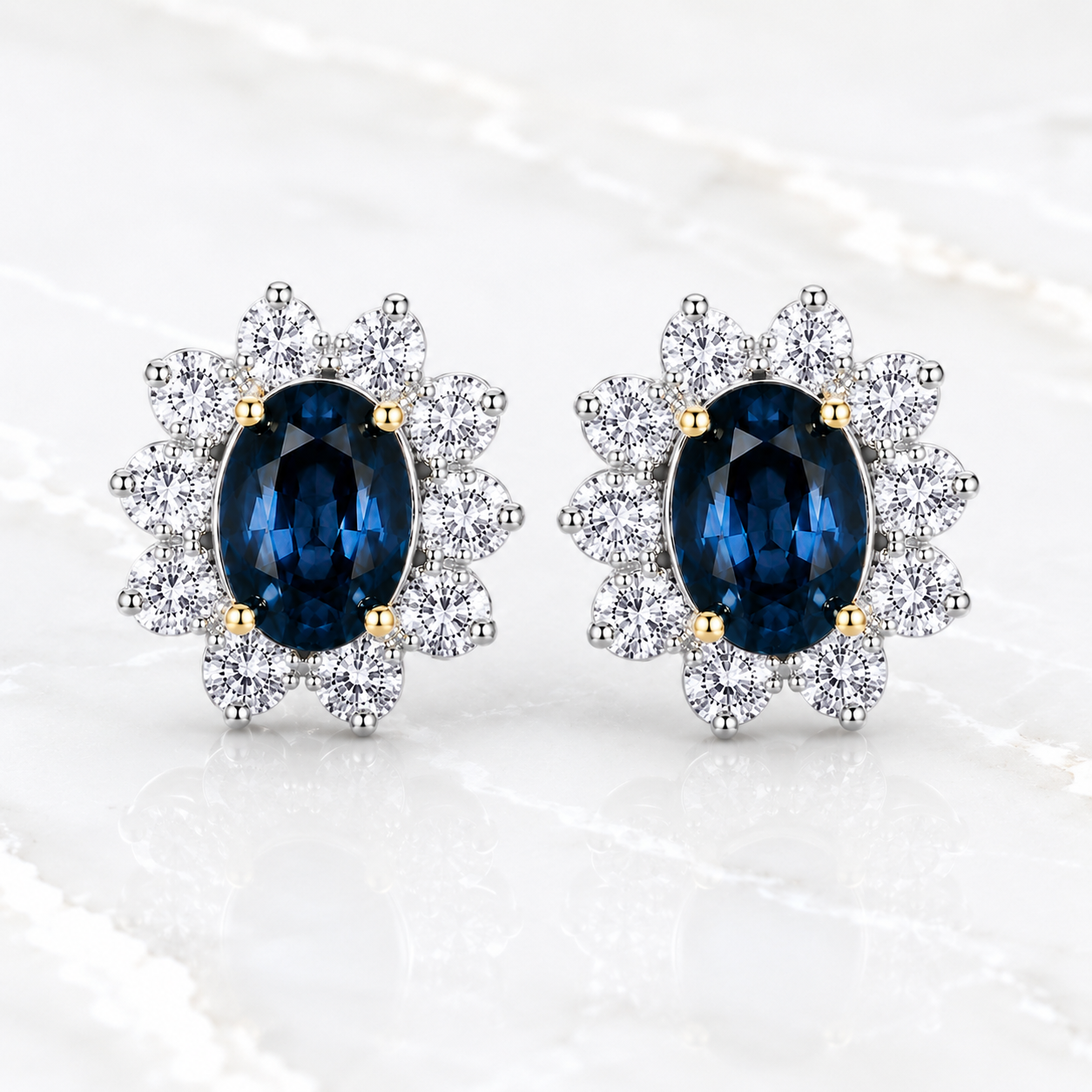 Natural 5x7mm oval London Blue Topaz halo stud earrings in platinum plated sterling silver with cubic zirconia on a white background.