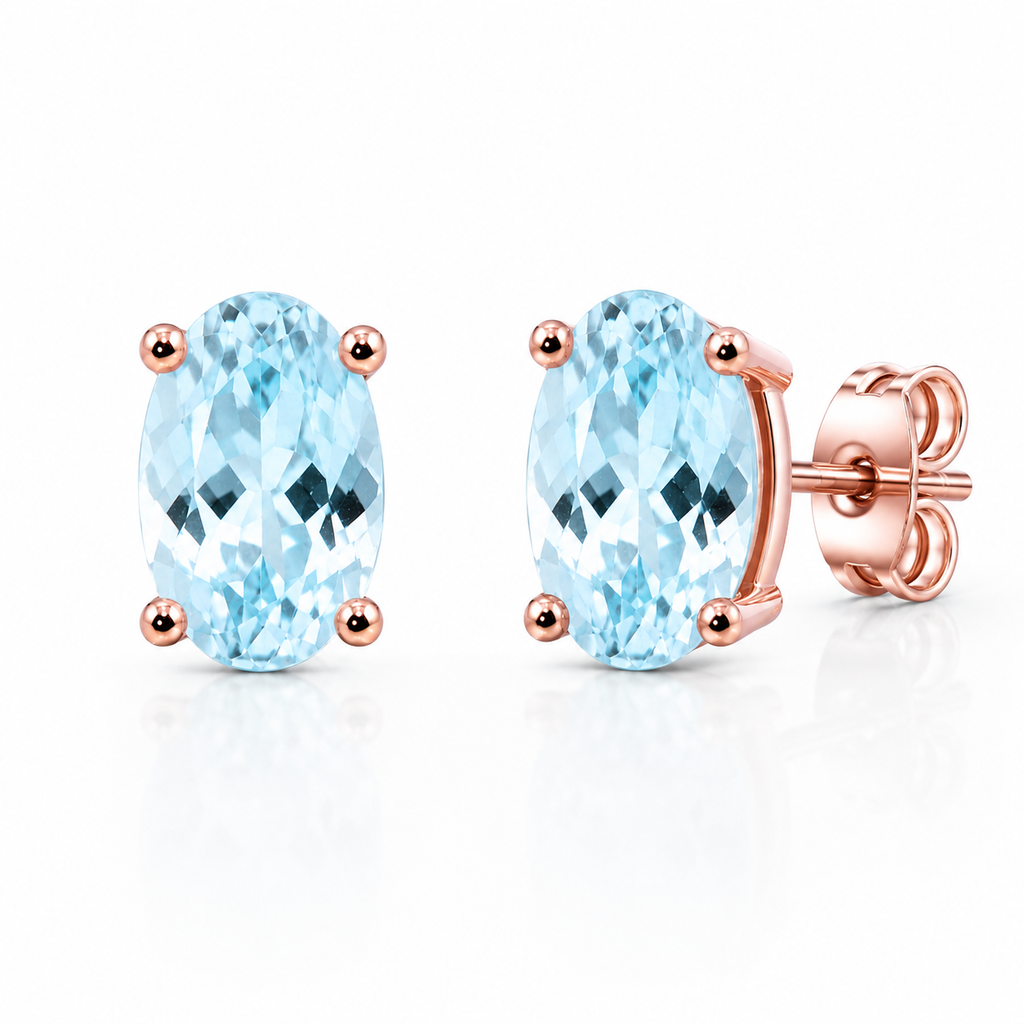45-degree view of genuine 4x6mm oval aquamarine stud earrings in sterling silver