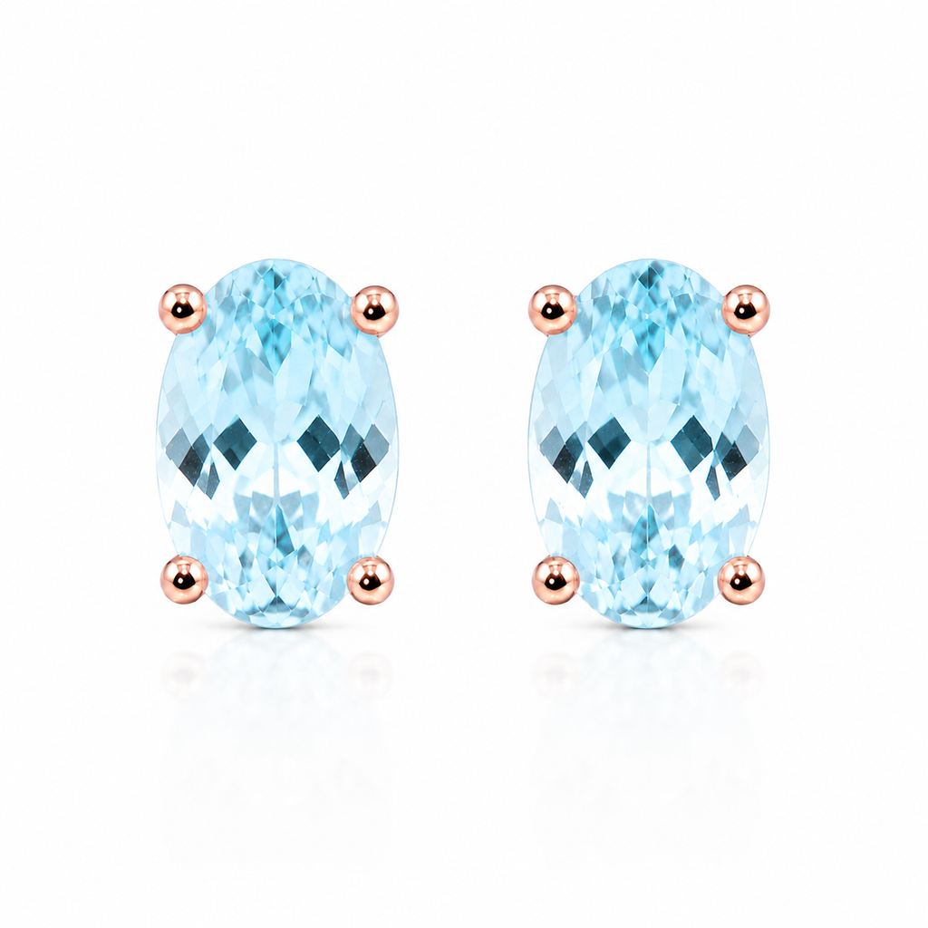Top-down view of natural oval aquamarine stud earrings featuring genuine 4x6mm aquamarine gemstones