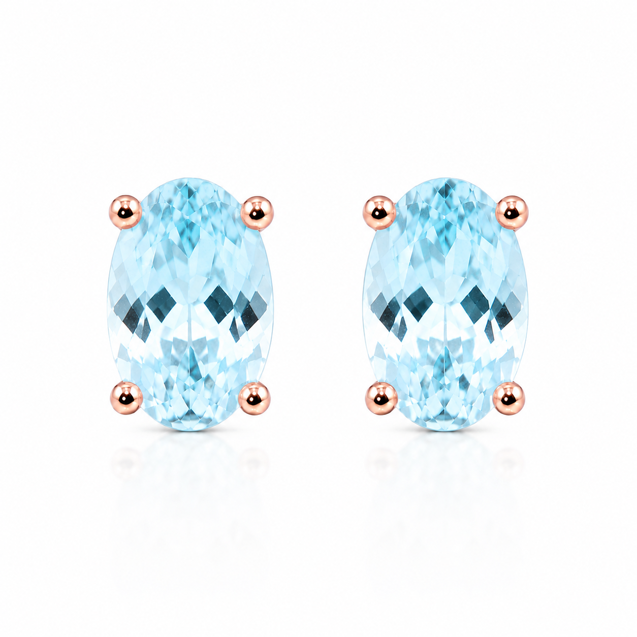 Top-down view of natural oval aquamarine stud earrings featuring genuine 4x6mm aquamarine gemstones