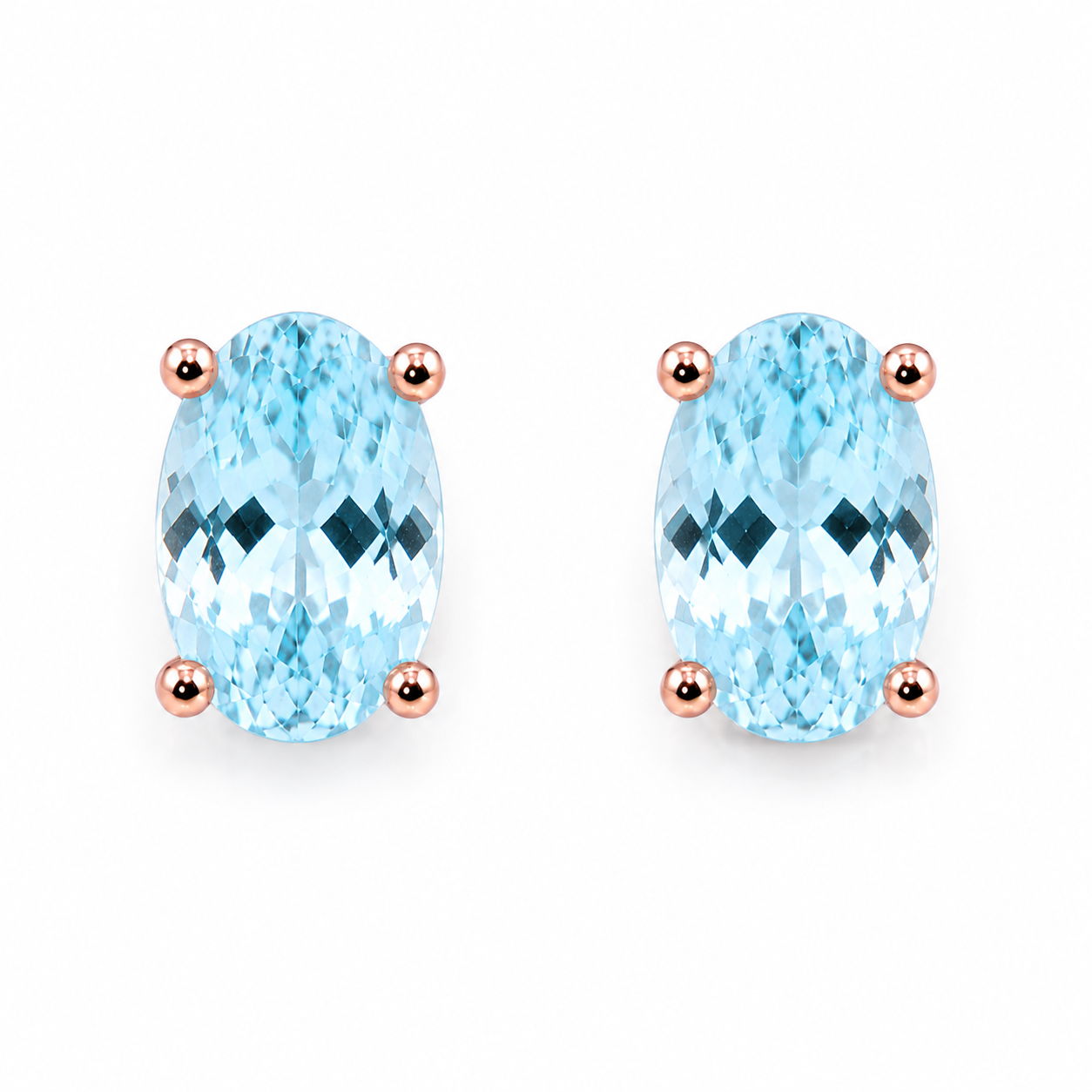 Natural 4x6mm oval aquamarine stud earrings in 925 sterling silver on a white background