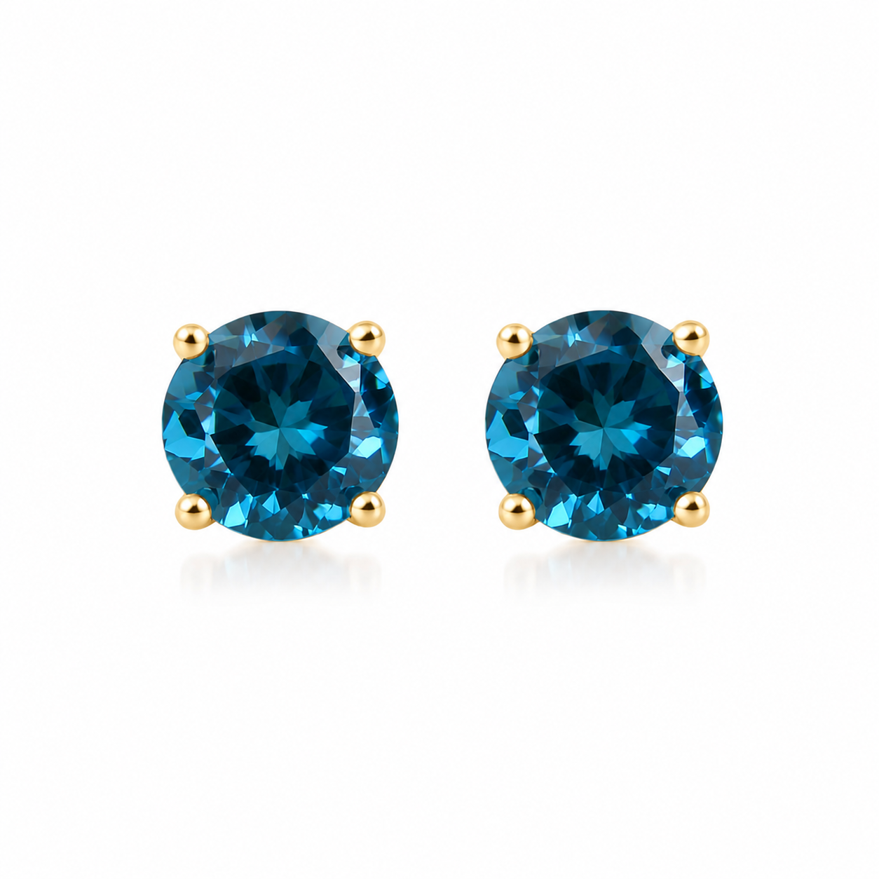5mm round London Blue Topaz stud earrings in solid 925 sterling silver with four-prong settings on a white background
