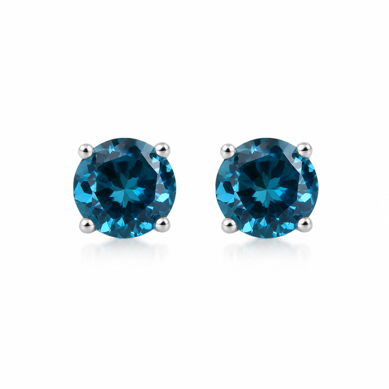 5mm round London Blue Topaz stud earrings in solid 925 sterling silver with four-prong settings on a white background