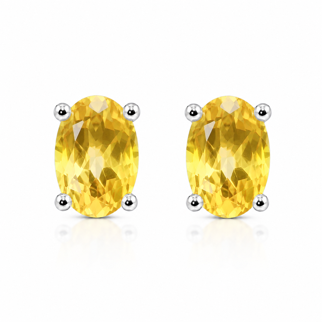 Natural 4x6mm oval citrine stud earrings in platinum plated 925 sterling silver front view