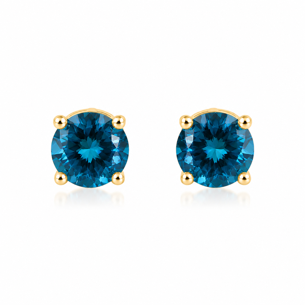5mm round London Blue Topaz stud earrings in solid 925 sterling silver with four-prong settings on a white background