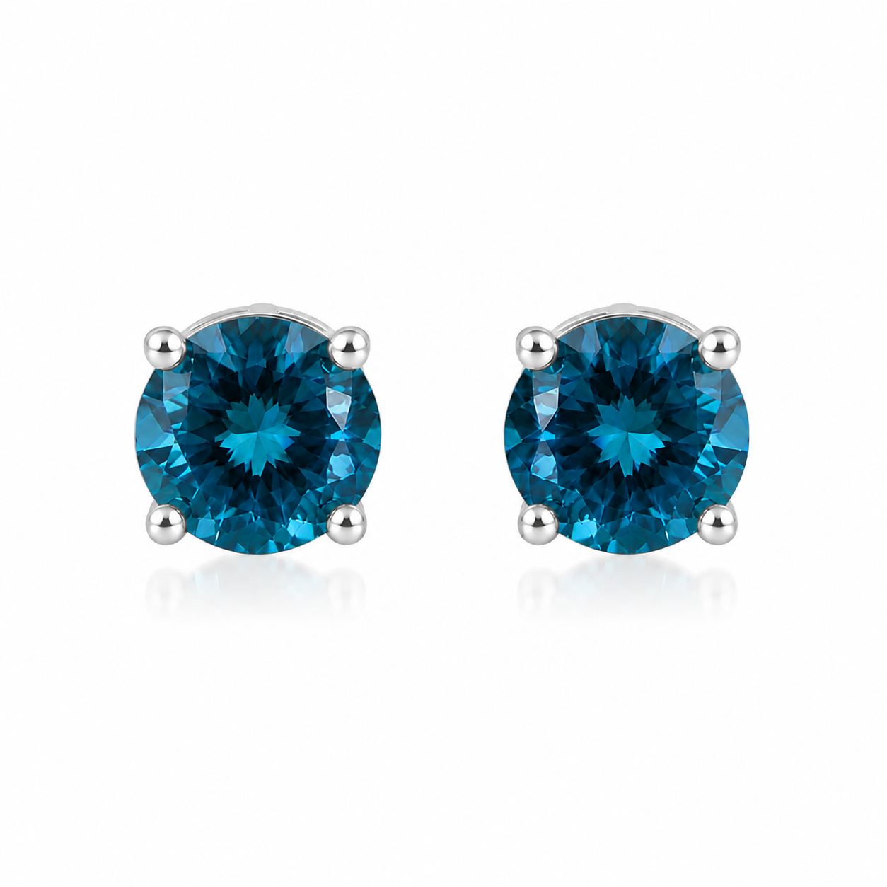 5mm round London Blue Topaz stud earrings in solid 925 sterling silver with four-prong settings on a white background