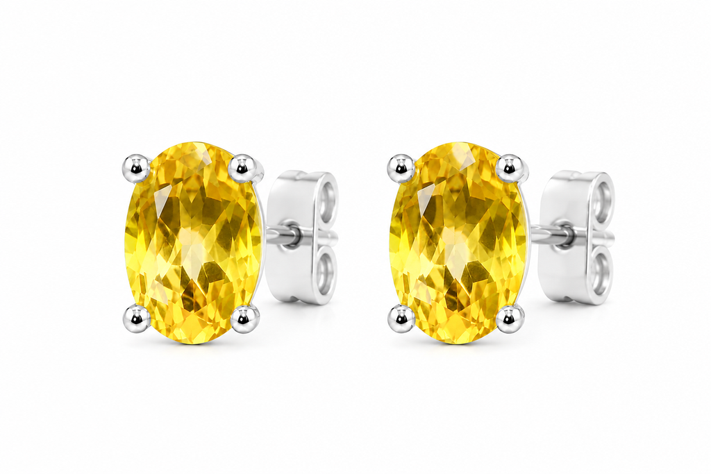 Top view of natural 4x6mm oval citrine stud earrings in 925 sterling silver
