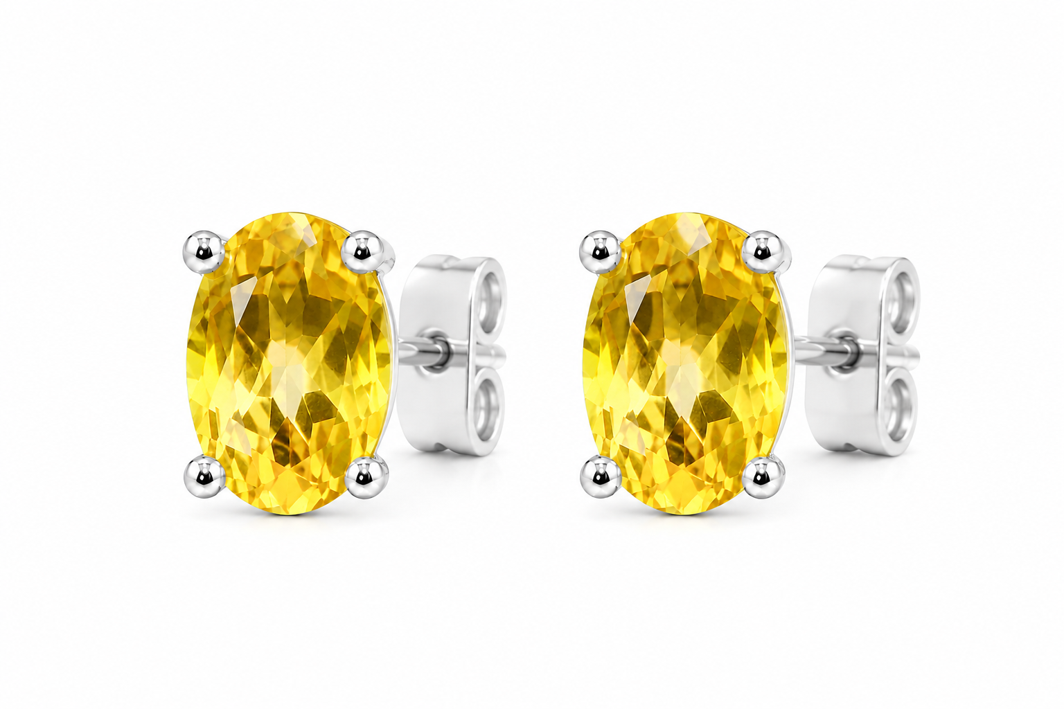 Top view of natural 4x6mm oval citrine stud earrings in 925 sterling silver