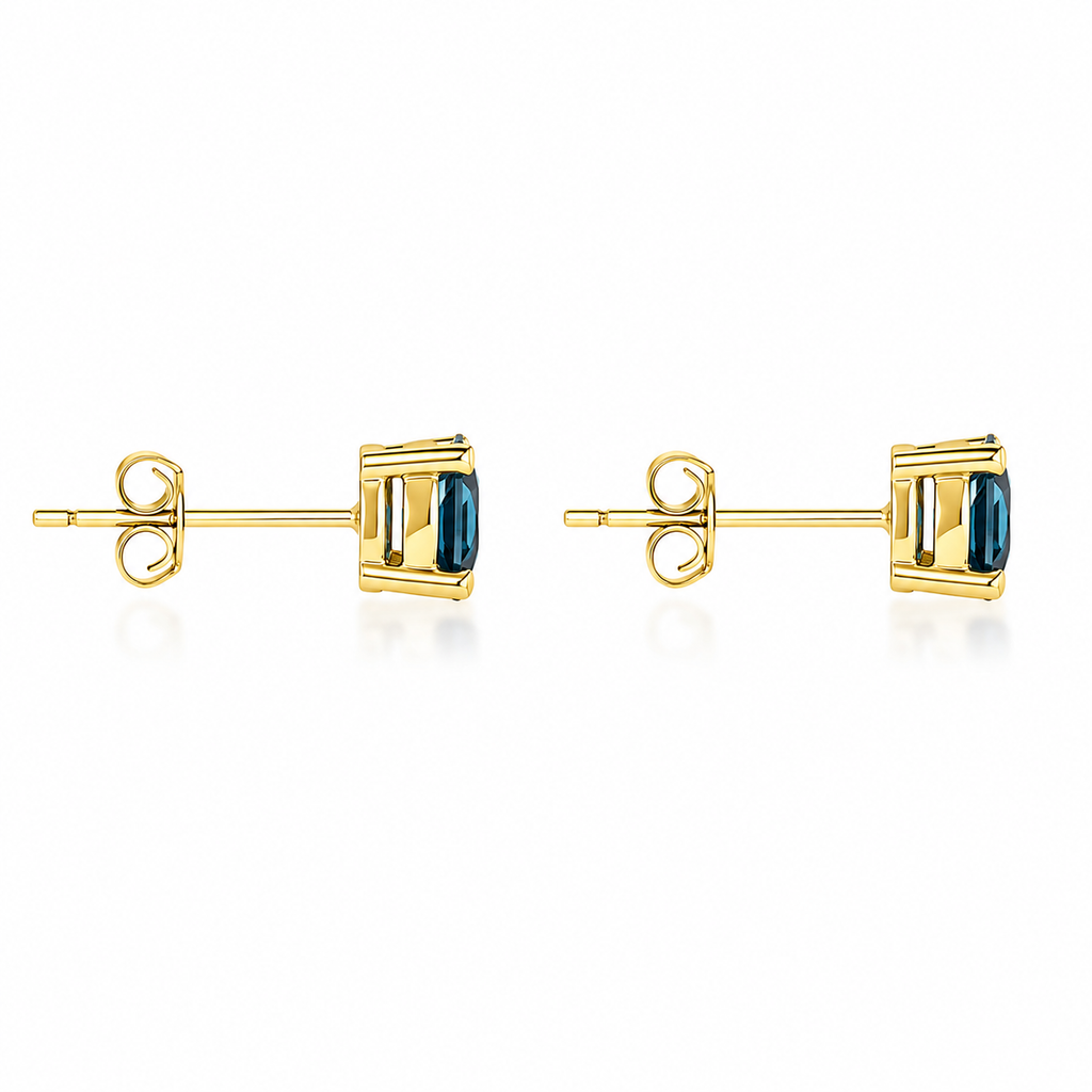 5mm round London Blue Topaz stud earrings in solid 925 sterling silver with four-prong settings on a white background