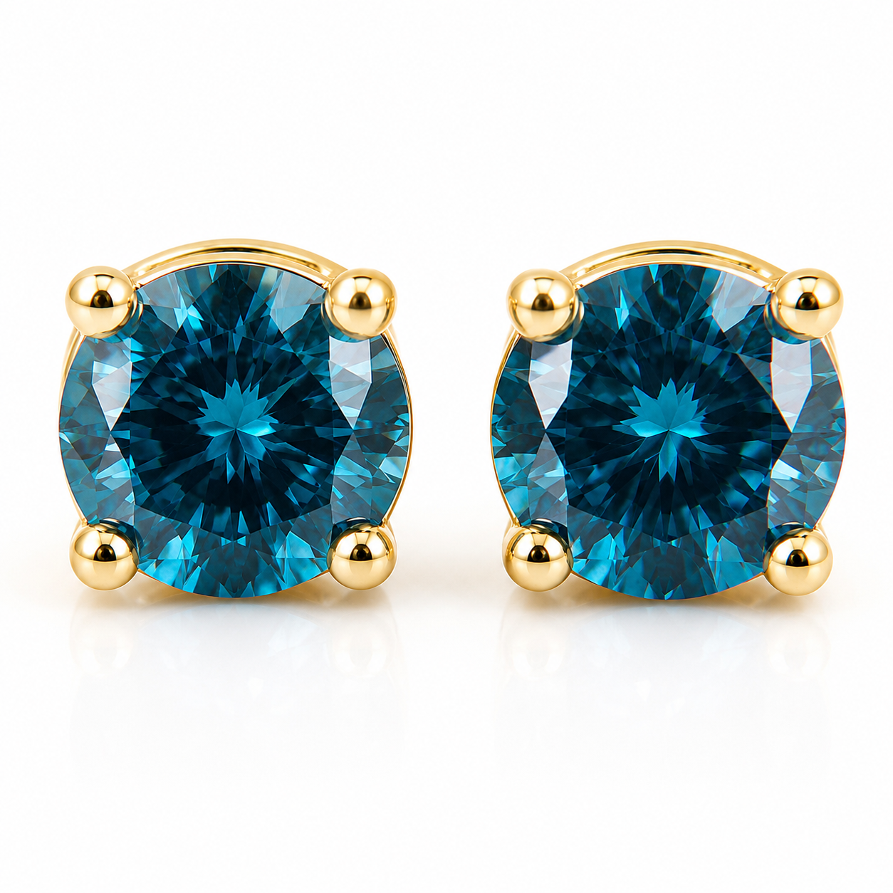 5mm round London Blue Topaz stud earrings in solid 925 sterling silver with four-prong settings on a white background