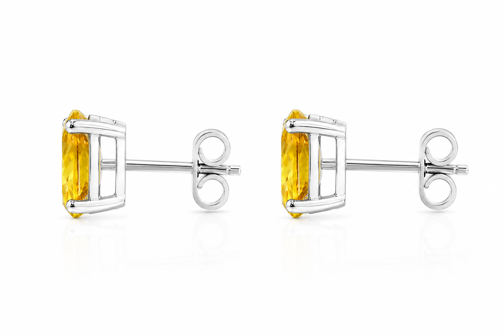 Side profile of natural oval citrine stud earrings showing classic four-prong solitaire setting