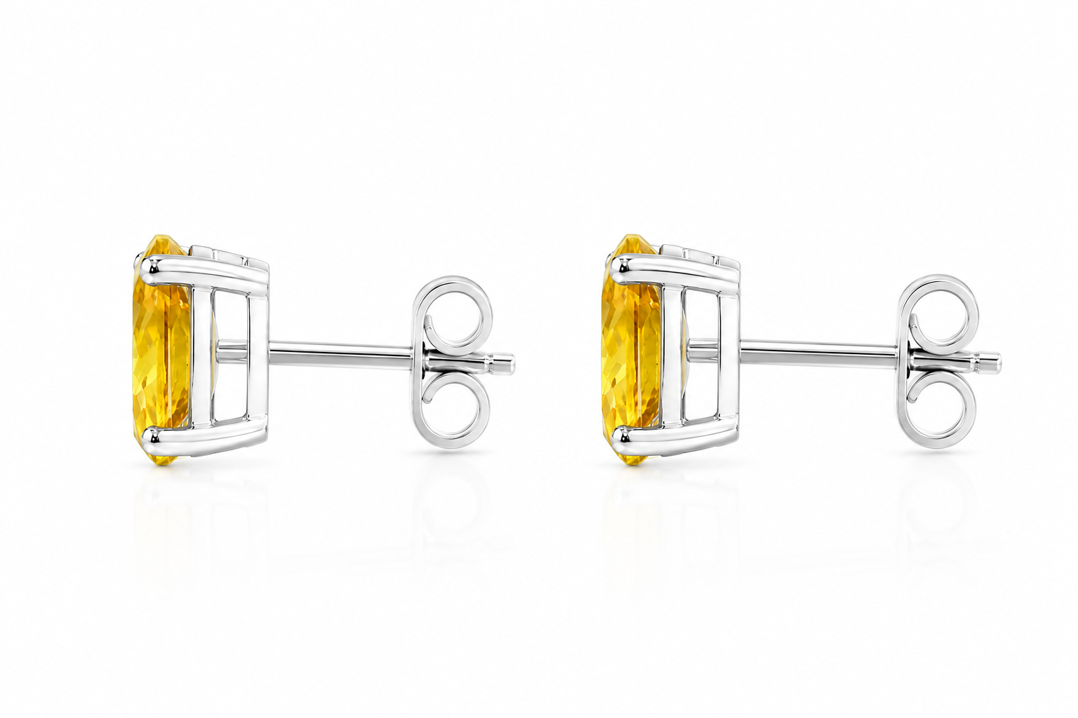 Side profile of natural oval citrine stud earrings showing classic four-prong solitaire setting