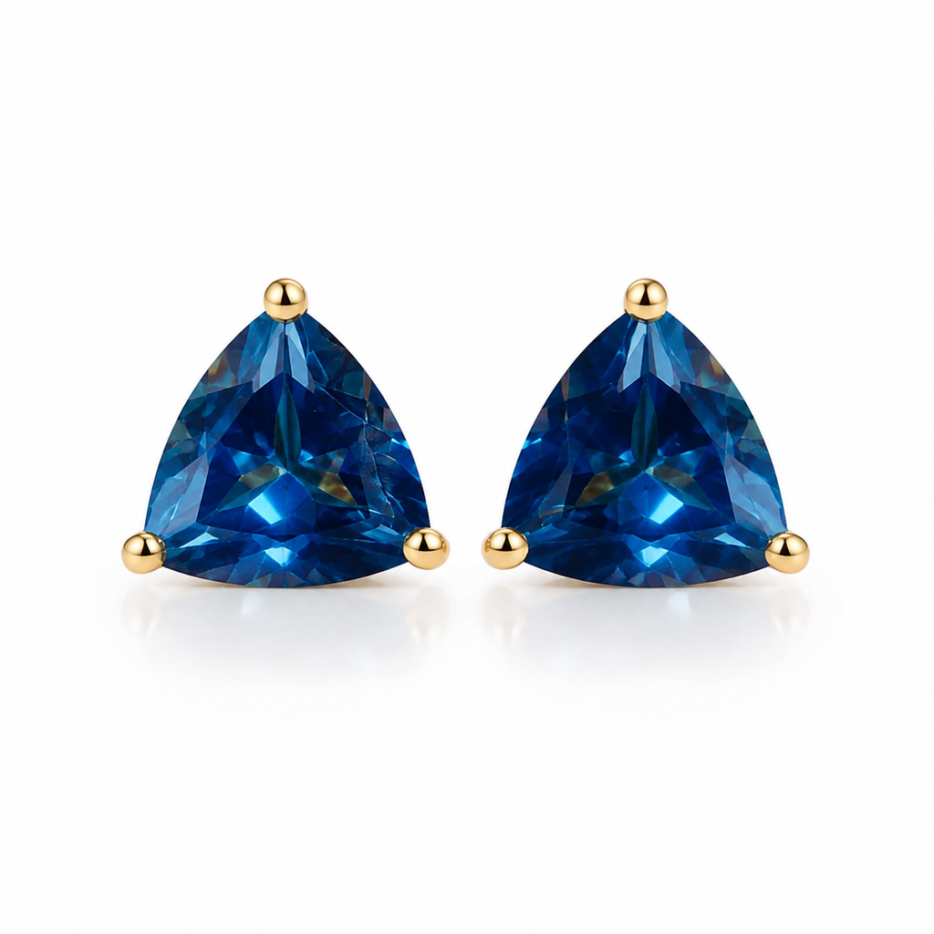 Natural 7mm trillion-cut London Blue Topaz stud earrings in solid 925 sterling silver with classic three-prong settings on a white background