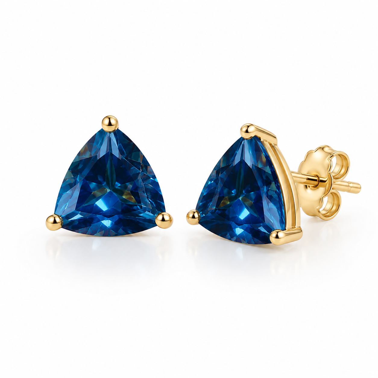 Natural 7mm trillion-cut London Blue Topaz stud earrings in solid 925 sterling silver with classic three-prong settings on a white background