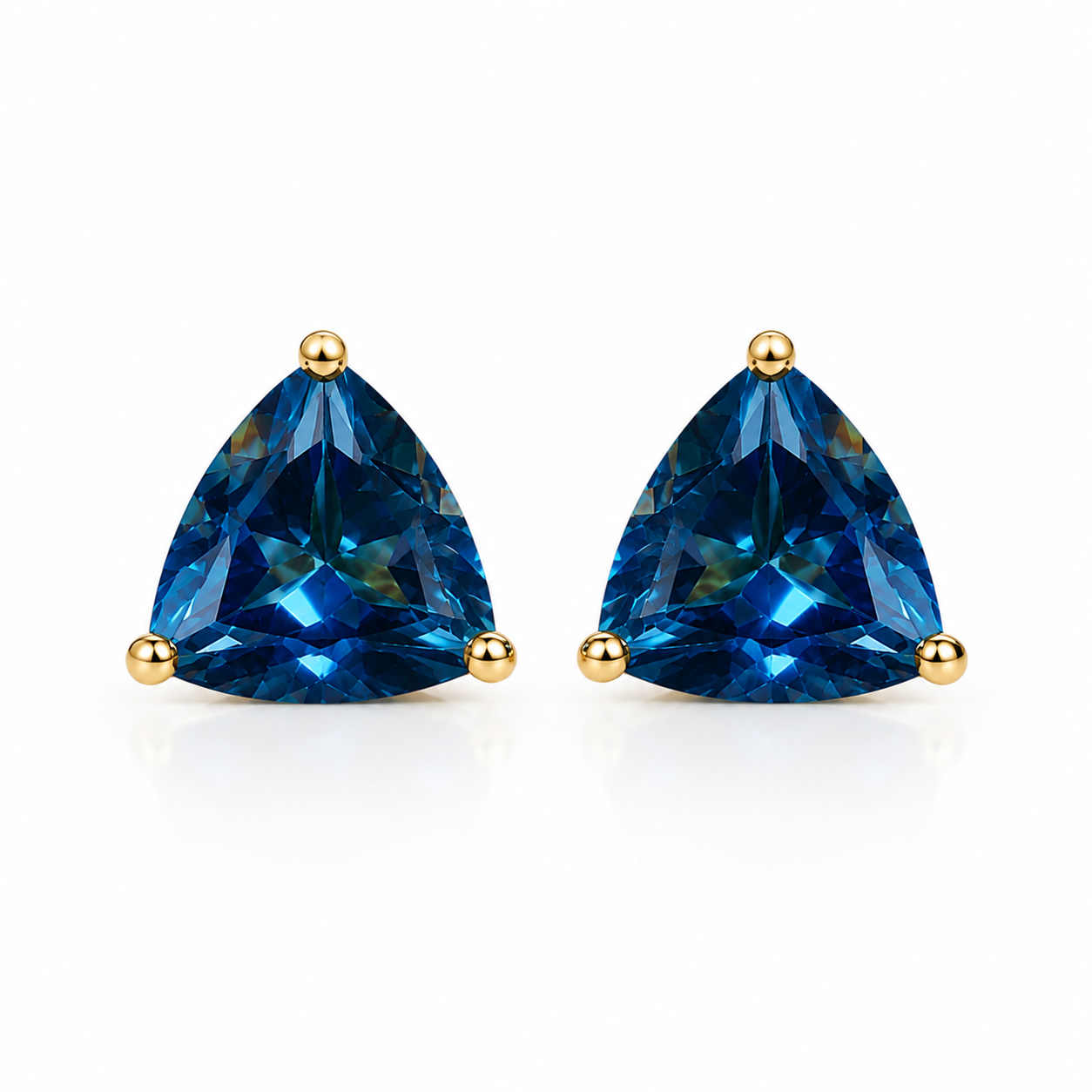 Natural 7mm trillion-cut London Blue Topaz stud earrings in solid 925 sterling silver with classic three-prong settings on a white background