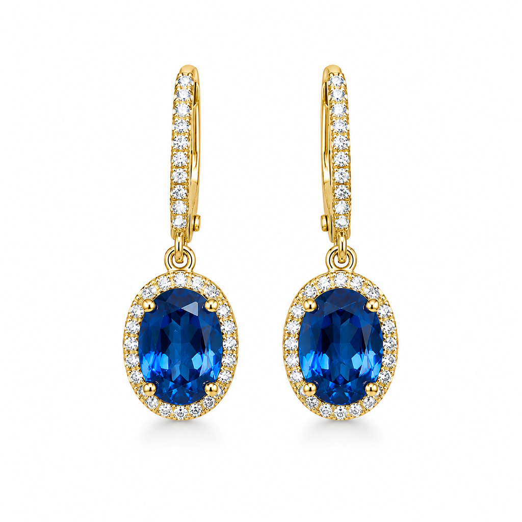 Natural 6x8mm oval London Blue Topaz halo dangle earrings in solid 925 sterling silver with secure leverback closures, available in platinum, yellow gold, or rose gold finish, presented in a PHIMSERA gift box.