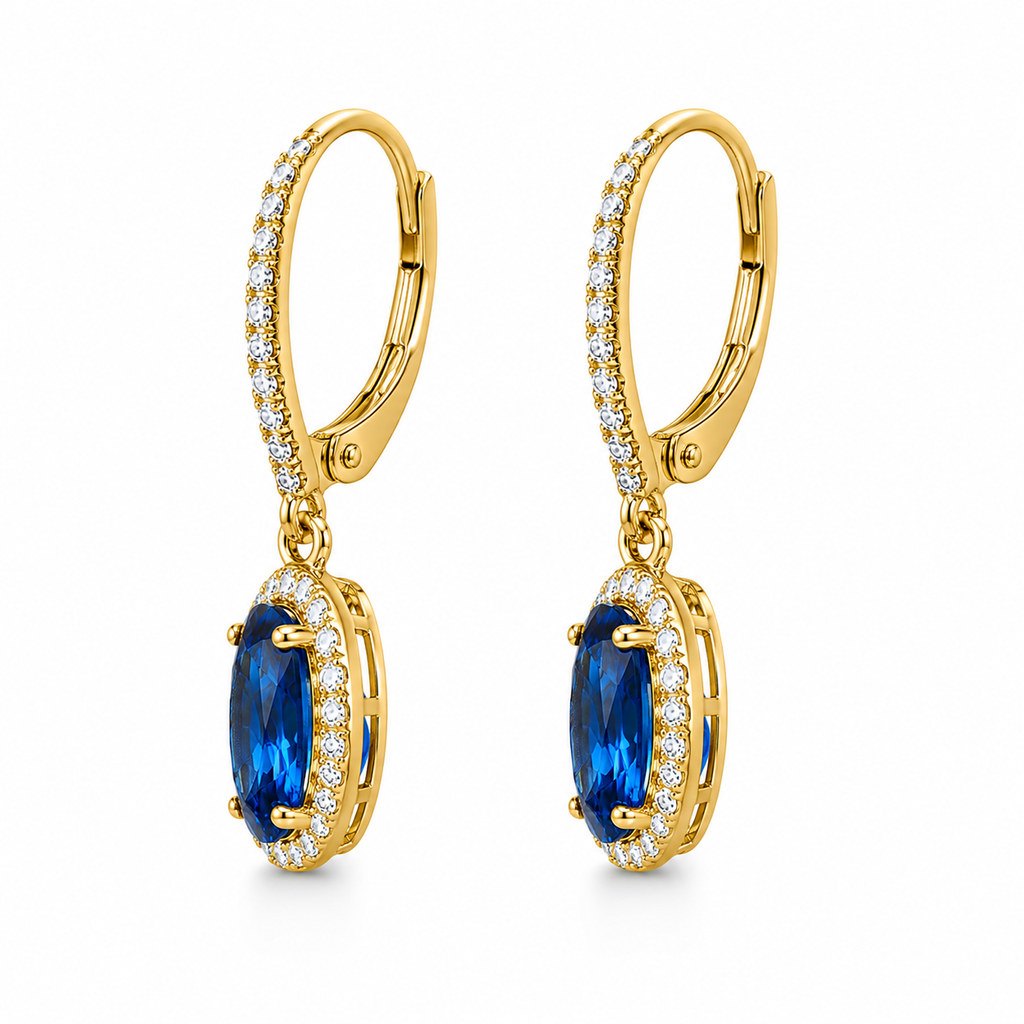 Natural 6x8mm oval London Blue Topaz halo dangle earrings in solid 925 sterling silver with secure leverback closures, available in platinum, yellow gold, or rose gold finish, presented in a PHIMSERA gift box.