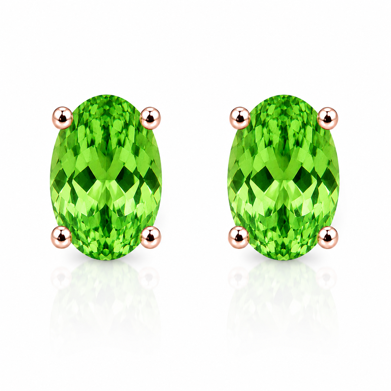 Natural 4x6mm oval tsavorite garnet stud earrings in 925 sterling silver solitaire setting on white background