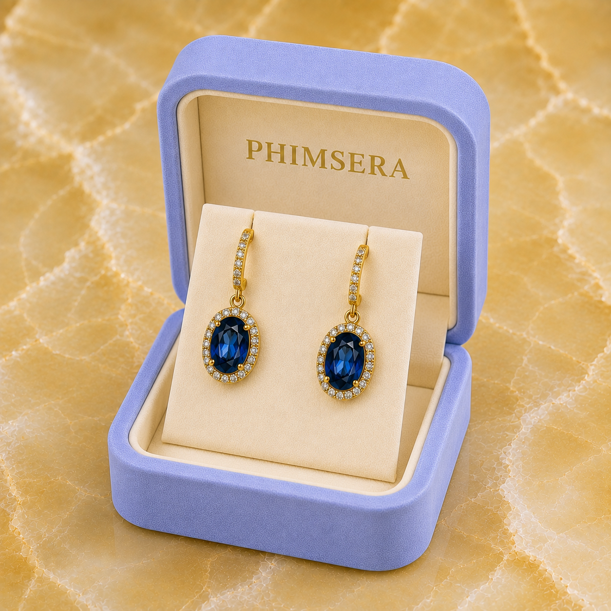 Natural 6x8mm oval London Blue Topaz halo dangle earrings in solid 925 sterling silver with secure leverback closures, available in platinum, yellow gold, or rose gold finish, presented in a PHIMSERA gift box.