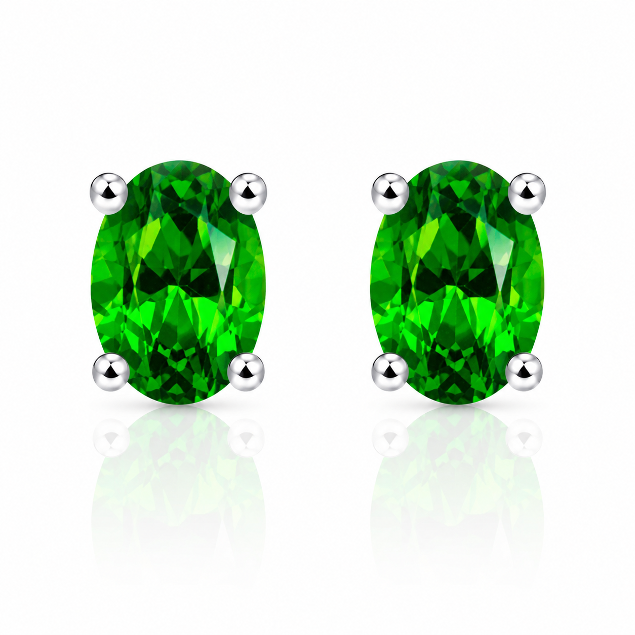 Natural 4x6mm oval chrome diopside stud earrings in 925 sterling silver on white background