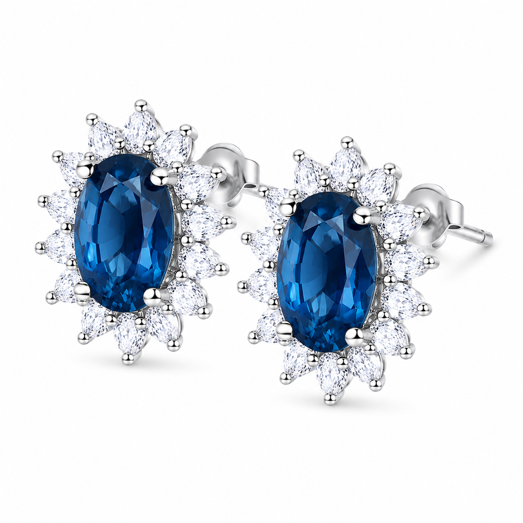 Natural 6x8mm oval London Blue Topaz halo stud earrings in solid 925 sterling silver, available in platinum, yellow gold, or rose gold finish, presented in a PHIMSERA gift box.
