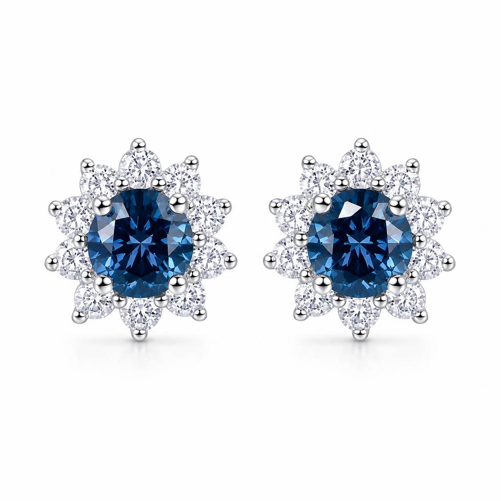 PHIMSERA Natural 5mm round London Blue Topaz floral halo stud earrings in solid 925 sterling silver with platinum plating, available in yellow gold or rose gold plating, presented in a PHIMSERA gift box.