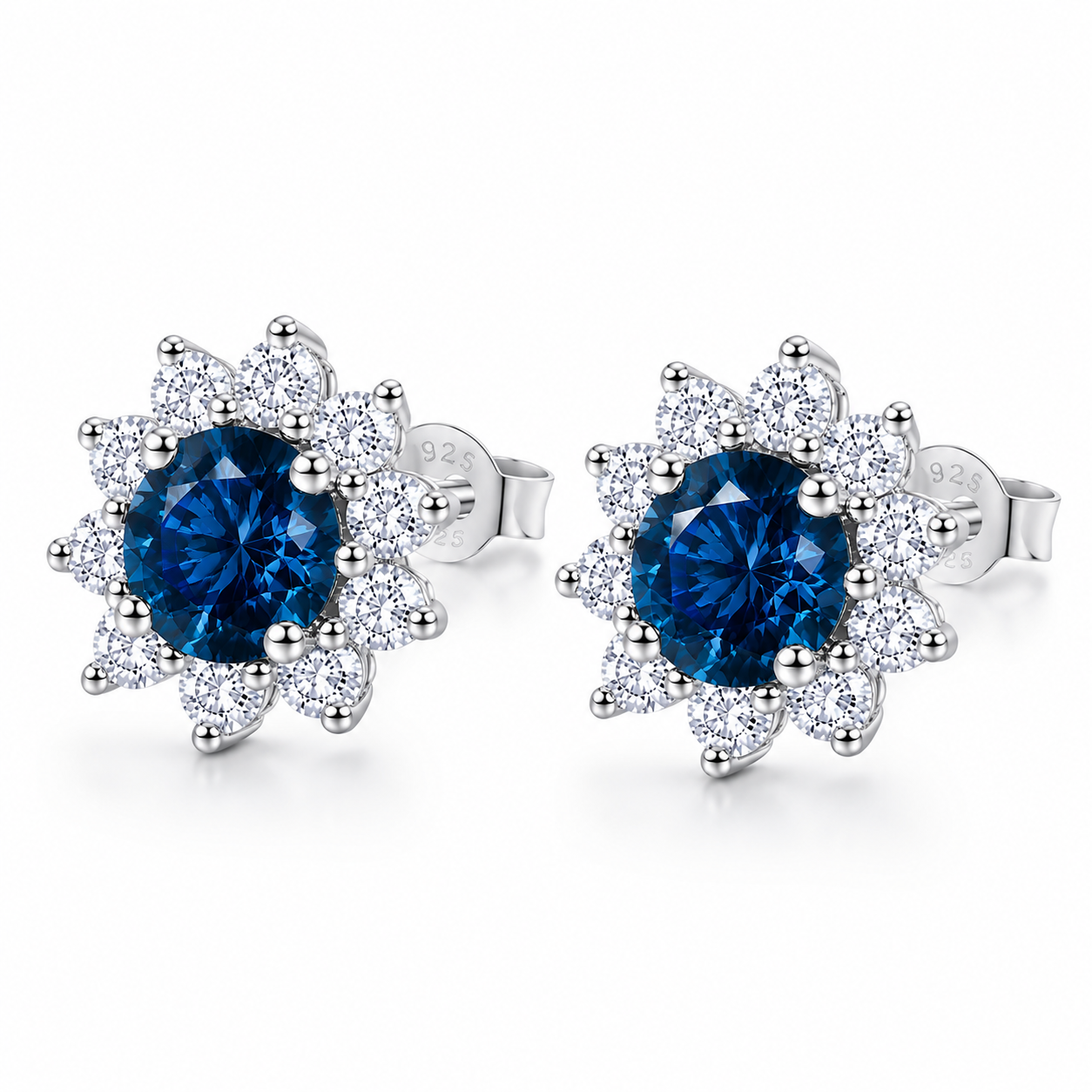 PHIMSERA Natural 5mm round London Blue Topaz floral halo stud earrings in solid 925 sterling silver with platinum plating, available in yellow gold or rose gold plating, presented in a PHIMSERA gift box.