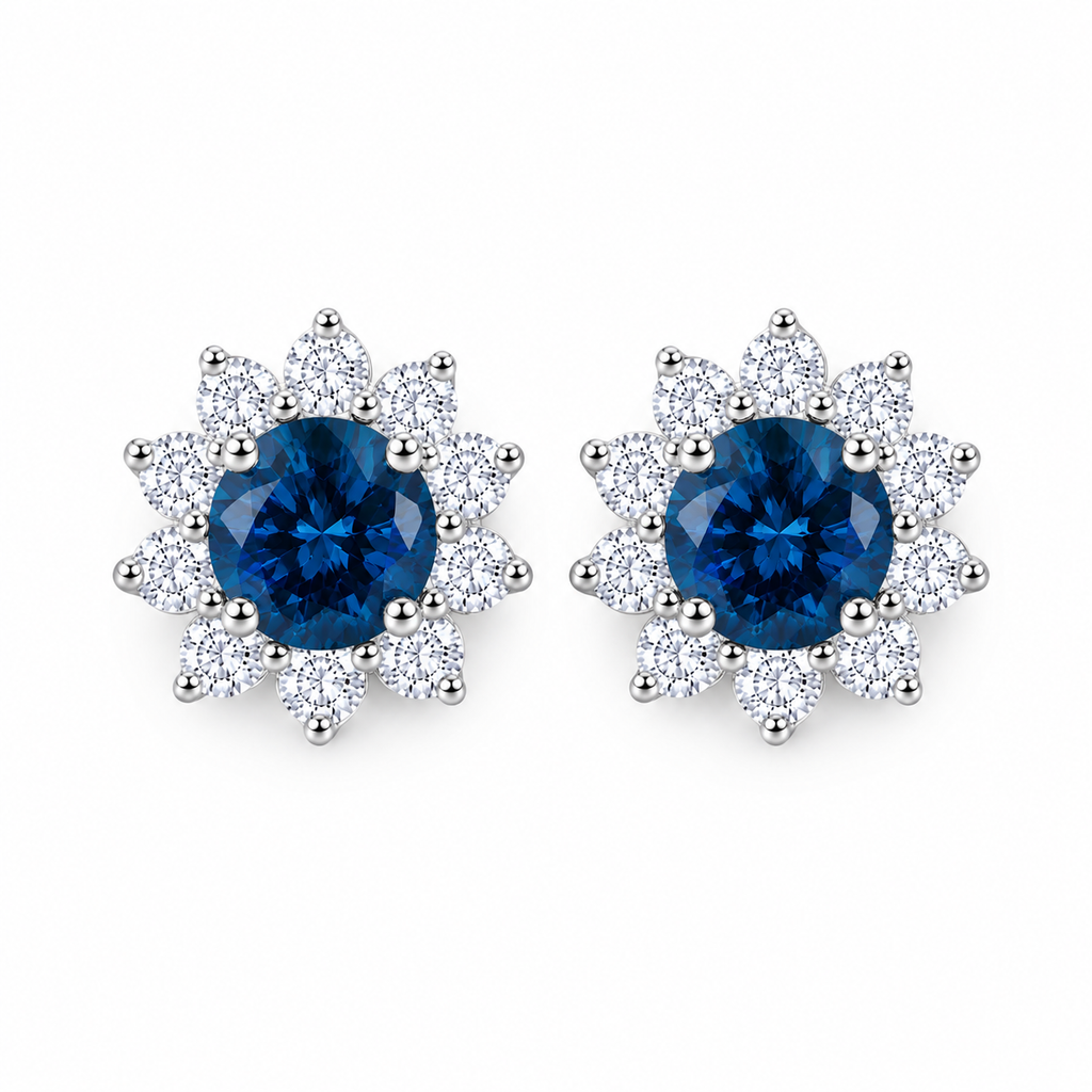 PHIMSERA Natural 5mm round London Blue Topaz floral halo stud earrings in solid 925 sterling silver with platinum plating, available in yellow gold or rose gold plating, presented in a PHIMSERA gift box.