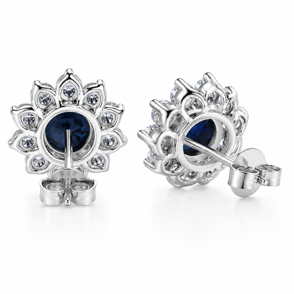 PHIMSERA Natural 5mm round London Blue Topaz floral halo stud earrings in solid 925 sterling silver with platinum plating, available in yellow gold or rose gold plating, presented in a PHIMSERA gift box.