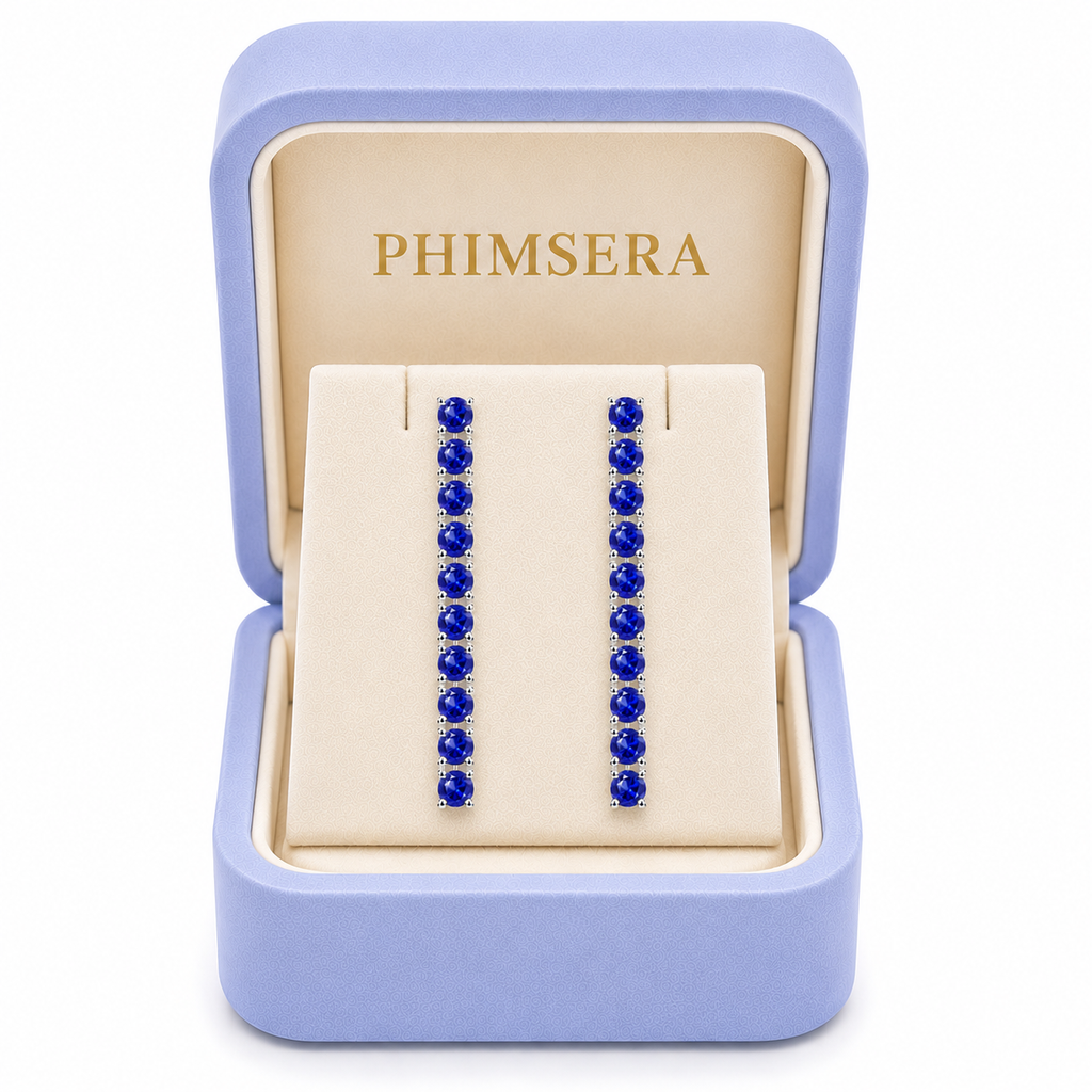 Phimsera 3mm round blue sapphire dangle earrings presented inside a Phimsera jewelry box