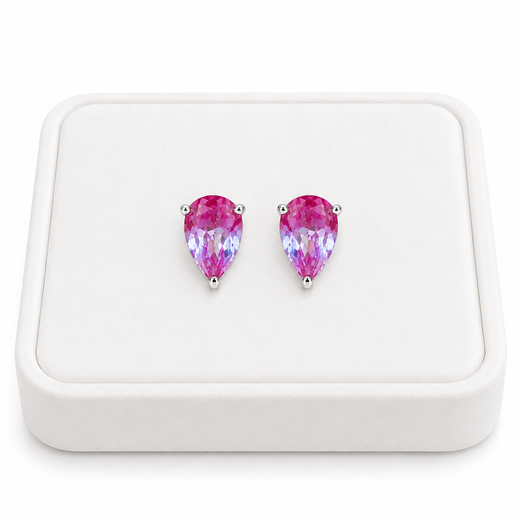 4x6mm pear cut lab created alexandrite stud earrings displayed on a white velvet jewelry tray