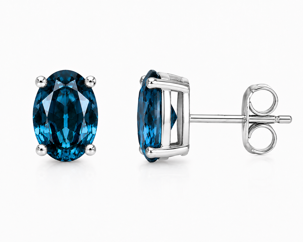 Natural 4x6mm oval London Blue Topaz solitaire stud earrings in 925 sterling silver with platinum plated finish