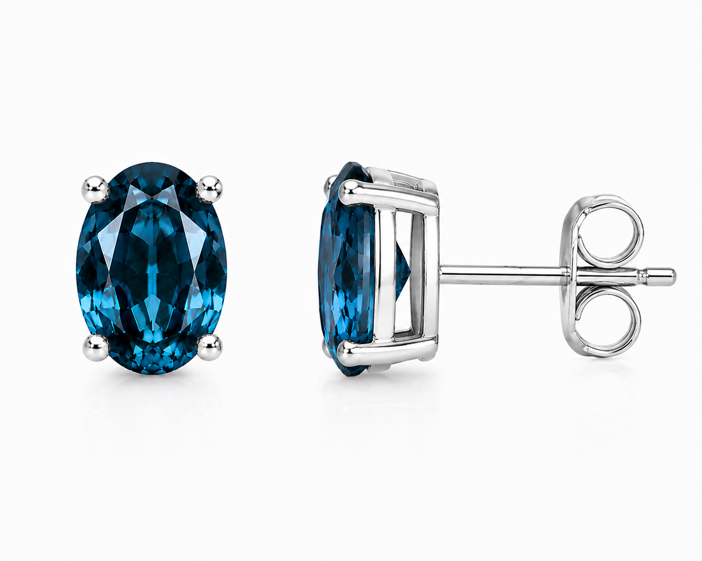 Natural 4x6mm oval London Blue Topaz solitaire stud earrings in 925 sterling silver with platinum plated finish